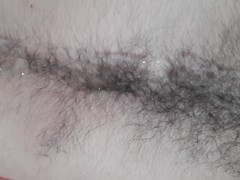'Laid back otter masturbating, shooting cum on hairy belly and chest'
