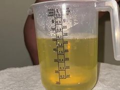 Huge piss and massive cumshot in cup
