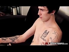 Tattooed skinny amateur is jacking off his cock and cumming