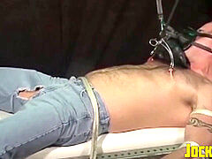 dominated man restrained as his nips are tantalized